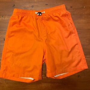 Orange swimsuit with compression shorts interior.